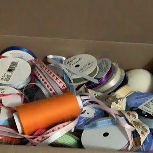 Box of assorted notions and art supplies.